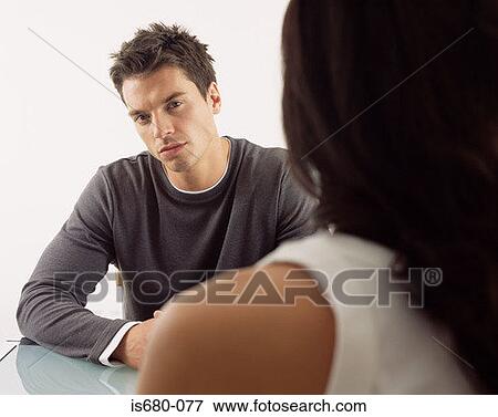 Man sitting opposite woman View Large Photo Image Stock Photo - Man sitting opposite woman. Fotosearch