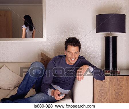 Man watching television View Large Photo Image Stock Photo - Man watching television. Fotosearch
