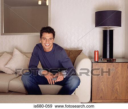 Man watching television View Large Photo Image Stock Photo - Man watching television. Fotosearch