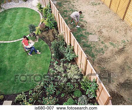 Neighbours in their gardens View Large Photo Image Stock Photo - Neighbours in their gardens. Fotosearch