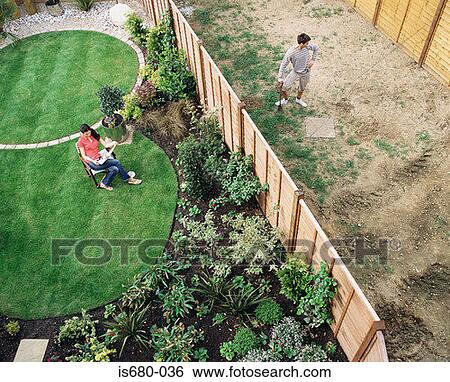 Neighbours in their gardens View Large Photo Image Stock Photograph - Neighbours in their gardens. Fotosearch