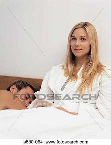 Young couple in bed View Large Photo Image Picture - Young couple in bed. Fotosearch