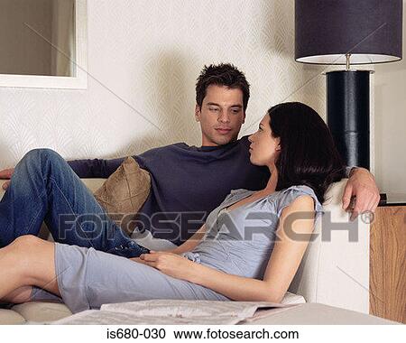 Young couple on the sofa View Large Photo Image Stock Image - Young couple on the sofa. Fotosearch