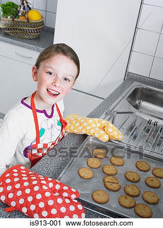 Girl baking biscuits View Large Photo Image Stock Image - Girl baking biscuits. Fotosearch