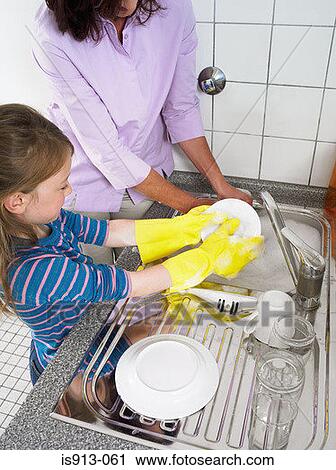 Girl helping with the washing up View Large Photo Image Stock Image - Girl helping with the washing up. Fotosearch