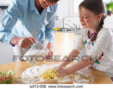 Mother and daughter mixing ingredients View Large Photo Image Stock Photo - Mother and daughter mixing ingredients. Fotosearch