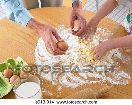 Woman and girl mixing ingredients View Large Photo Image Picture - Woman and girl mixing ingredients. Fotosearch