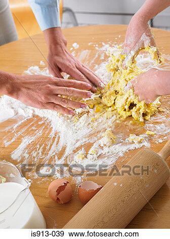 Woman and girl mixing ingredients View Large Photo Image Stock Photo - Woman and girl mixing ingredients. Fotosearch