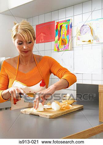 Woman chopping onion View Large Photo Image Stock Image - Woman chopping onion. Fotosearch