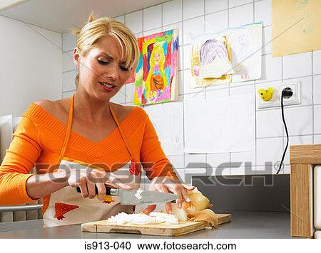 Woman chopping onions View Large Photo Image Stock Image - Woman chopping onions. Fotosearch