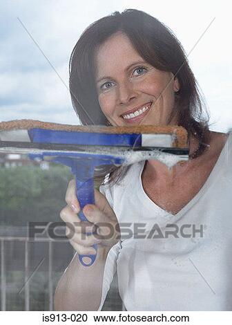 Woman cleaning window View Large Photo Image Stock Image - Woman cleaning window. Fotosearch