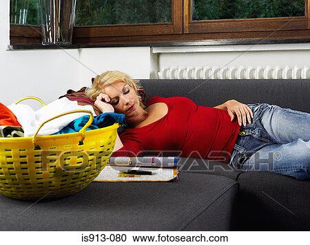 Woman lying on sofa View Large Photo Image Stock Image - Woman lying on sofa. Fotosearch