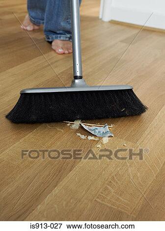 Woman sweeping up View Large Photo Image Stock Photo - Woman sweeping up. Fotosearch