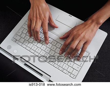 Woman typing on laptop computer View Large Photo Image Stock Photo - Woman typing on laptop computer. Fotosearch