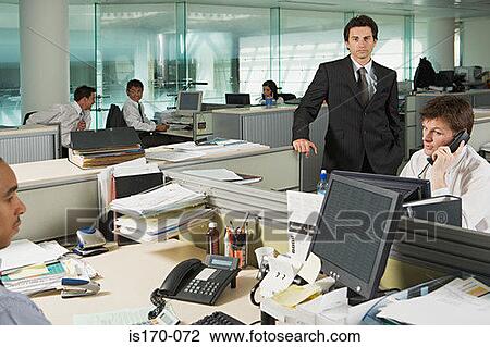 Businessman and office workers View Large Photo Image Stock Image - Businessman and office workers. Fotosearch