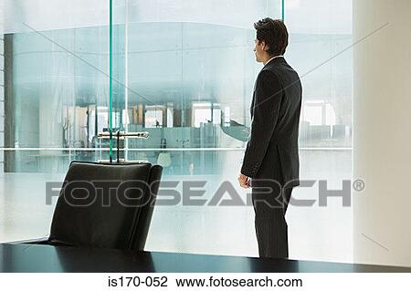 Businessman in his office View Large Photo Image Stock Image - Businessman in his office. Fotosearch