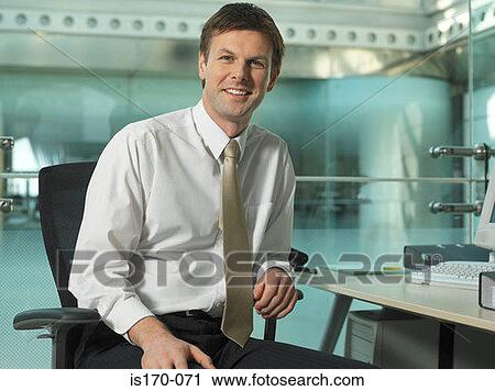 Businessman in his office View Large Photo Image Stock Image - Businessman in his office. Fotosearch