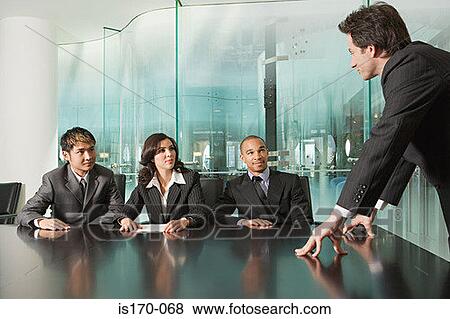 Businesspeople in a meeting View Large Photo Image Stock Photo - Businesspeople in a meeting. Fotosearch