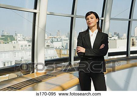 Businesswoman by a window View Large Photo Image Stock Photography - Businesswoman by a window. Fotosearch