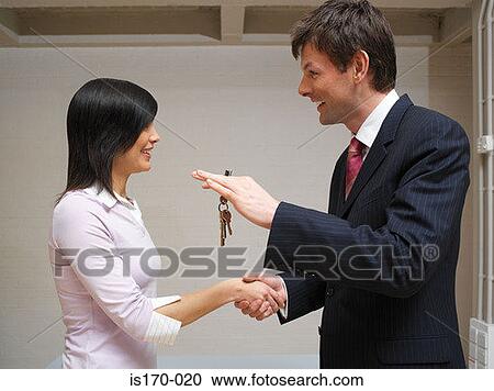 Man and woman exchanging keys View Large Photo Image Stock Image - Man and woman exchanging keys. Fotosearch