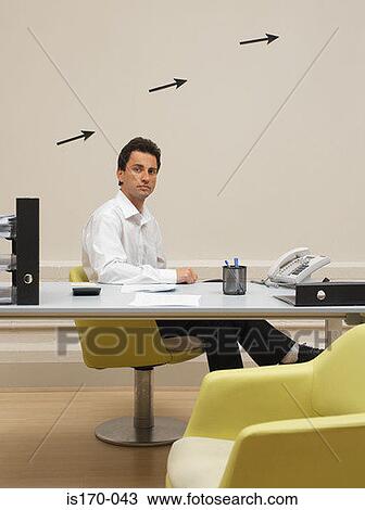 Man in his office View Large Photo Image Stock Image - Man in his office. Fotosearch