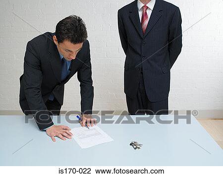 Man signing a contract View Large Photo Image Stock Image - Man signing a contract. Fotosearch
