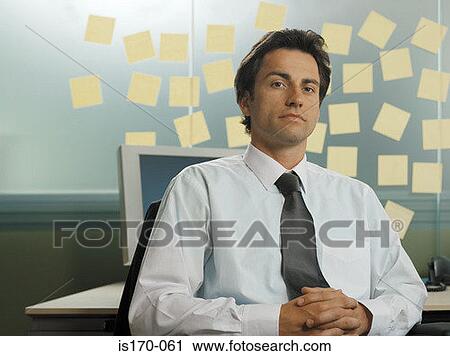 Man with adhesive notes in his office View Large Photo Image Stock Image - Man with adhesive notes in his office. Fotosearch
