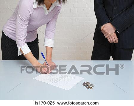 Woman signing a contract View Large Photo Image Stock Photography - Woman signing a contract. Fotosearch