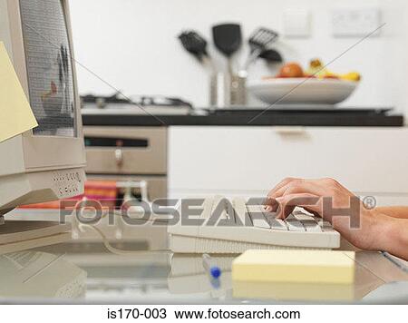 Stock Image - Woman typing. Fotosearch
