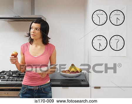 Woman with work in the kitchen View Large Photo Image Stock Photo - Woman with work in the kitchen. Fotosearch