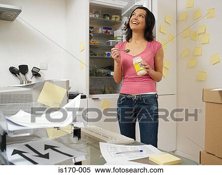 Woman with work in the kitchen View Large Photo Image Stock Photography - Woman with work in the kitchen. Fotosearch