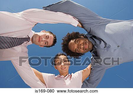 Businesspeople leaning together View Large Photo Image Stock Image - Businesspeople leaning together. Fotosearch