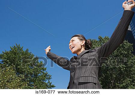 Businesswoman celebrating View Large Photo Image Stock Photo - Businesswoman celebrating. Fotosearch