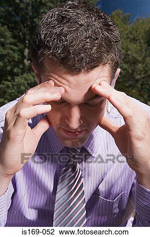 Stressed male office worker View Large Photo Image Stock Image - Stressed male office worker. Fotosearch