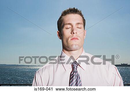Stock Image - Thoughtful looking man. Fotosearch