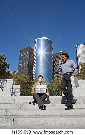 Two businessmen on steps View Large Photo Image Stock Image - Two businessmen on steps. Fotosearch