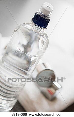 Stock Photograph - Bottle of water and a towel. Fotosearch