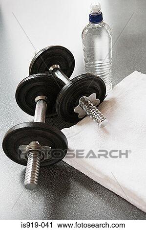 Dumbbells and mineral water View Large Photo Image Stock Image - Dumbbells and mineral water. Fotosearch