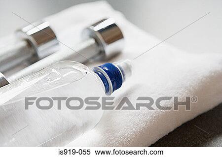 Dumbbells and mineral water View Large Photo Image Stock Photography - Dumbbells and mineral water. Fotosearch