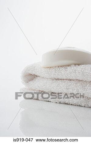 Soap on a white towel View Large Photo Image Stock Photo - Soap on a white towel. Fotosearch