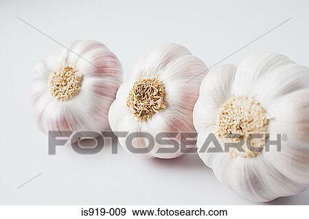 Three cloves of garlic View Large Photo Image Stock Photo - Three cloves of garlic. Fotosearch