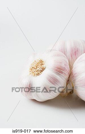 Three cloves of garlic View Large Photo Image Stock Photo - Three cloves of garlic. Fotosearch