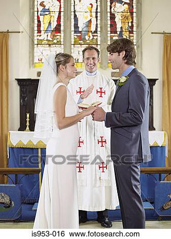 https://fscomps.fotosearch.com/compc/IGS/IGS598/bride-and-groom-saying-wedding-vows-stock-photograph__is953-016.jpg