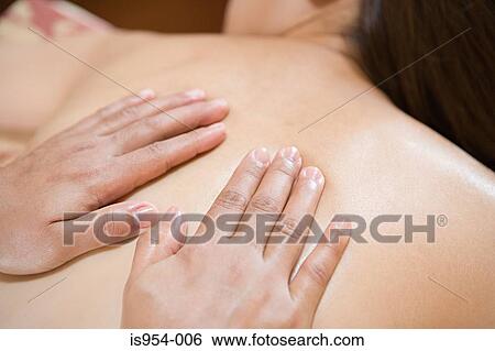 Hands massaging back View Large Photo Image Stock Photograph - Hands massaging back. Fotosearch