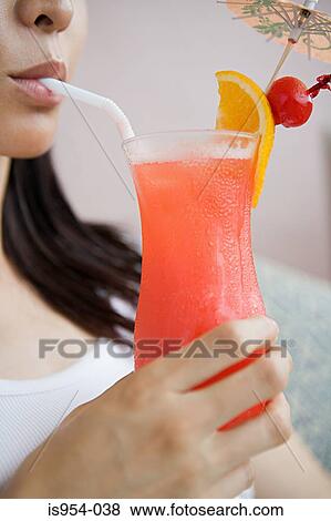 Woman drinking cocktail View Large Photo Image Stock Photo - Woman drinking cocktail. Fotosearch