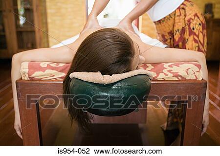 Woman having massage View Large Photo Image Stock Image - Woman having massage. Fotosearch