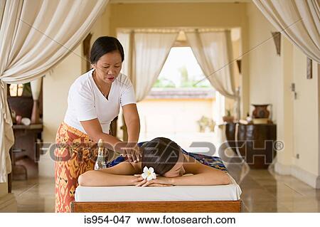 Woman having massage View Large Photo Image Stock Photo - Woman having massage. Fotosearch