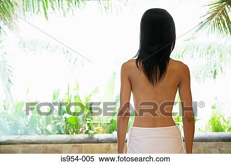 Stock Photography - Woman on balcony at health spa. Fotosearch