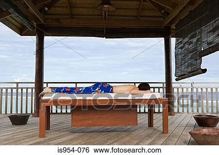 Stock Photograph - Woman on massage table. Fotosearch