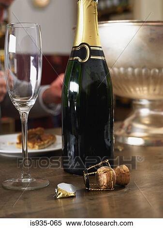 Champagne flute and bottle View Large Photo Image Stock Photography - Champagne flute and bottle. Fotosearch